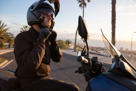 A Motorcyclist Sitting On His Motorcycle Is Wearin 2023 11 27 05 27 51 Utc 475x320